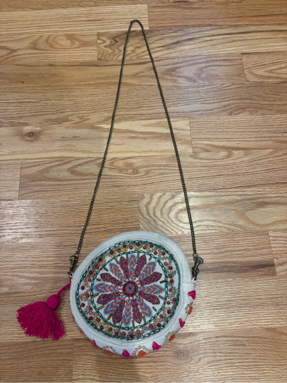 Embroidered Round Crossbody Bag in White with Pink Tassel